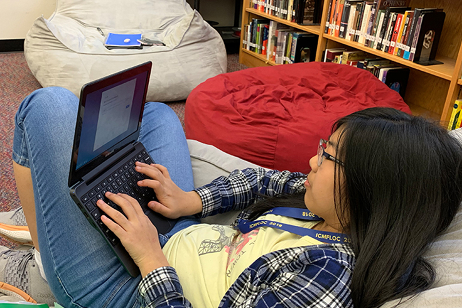 Whether+its+on+school+related+device+such+as+the+Chromebook+being+used+by+freshman+Emily+Gong+working+in+the+library+back+in+December%2C+or+a+students+own+personal+device%2C+the+Frisco+ISD+eLearning+system+launched+on+Tuesday+with+students+and+staff+adjusting+to+the+new+way+of+school+from+home.+