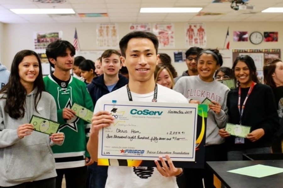 Biology teacher, Chris Ham celebrates after being rewarded with a check from the Frisco Education Foundation. Adding to his success for the year, Ham won Secondary Teacher of the Year after being named of the five finalists.