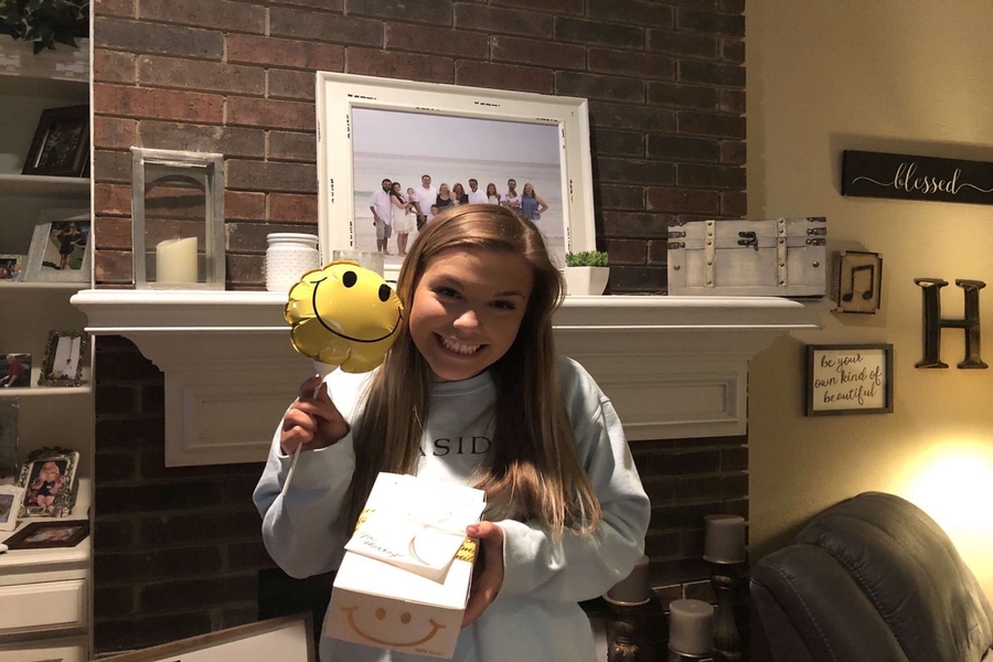 Senior Rileigh Horcher poses with her new treats. Starting as a Facebook trend, Adopt a Senior has allowed community members, friends, and family to spoil the seniors as their last year of high school was cut short.