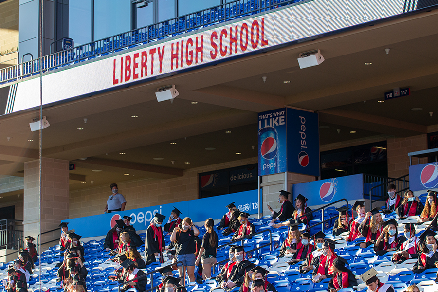 Sitting in the Hall of Fame section of Toyota Stadium, graduates are socially distanced at the start of the class of 2020 graduation ceremony at Toyota Stadium on Saturday, May 30, 2020.