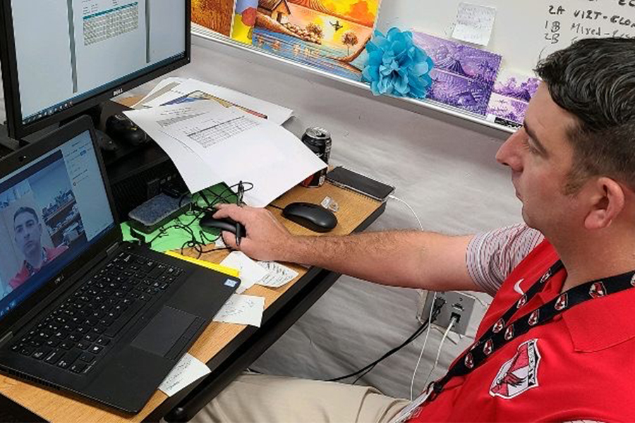 Economics teacher Fred Kaiser begins his Zoom meeting with students during first period in his classroom. Thursday marked the first day of school and the beginning of three weeks of strictly virtual instruction for students. 