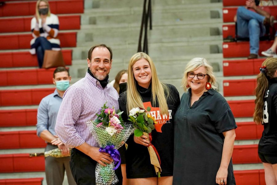 Senior+Sue+Slater+gets+escorted+down+the+court+by+her+mom+and+dad%2C+following+the+rest+of+her+senior+teammates.+Shortly+after+the+volleyball+team+beat+the+Centennial+Titians.+