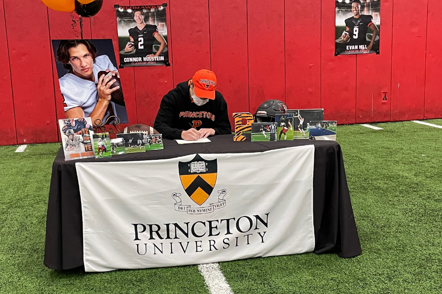 Committing+to+Princeton+University%2C+Connor+Hulstein+signs+his+letter+of+intent+to+continue+his+football+career+at+the+university+beginning+in+the+fall.+