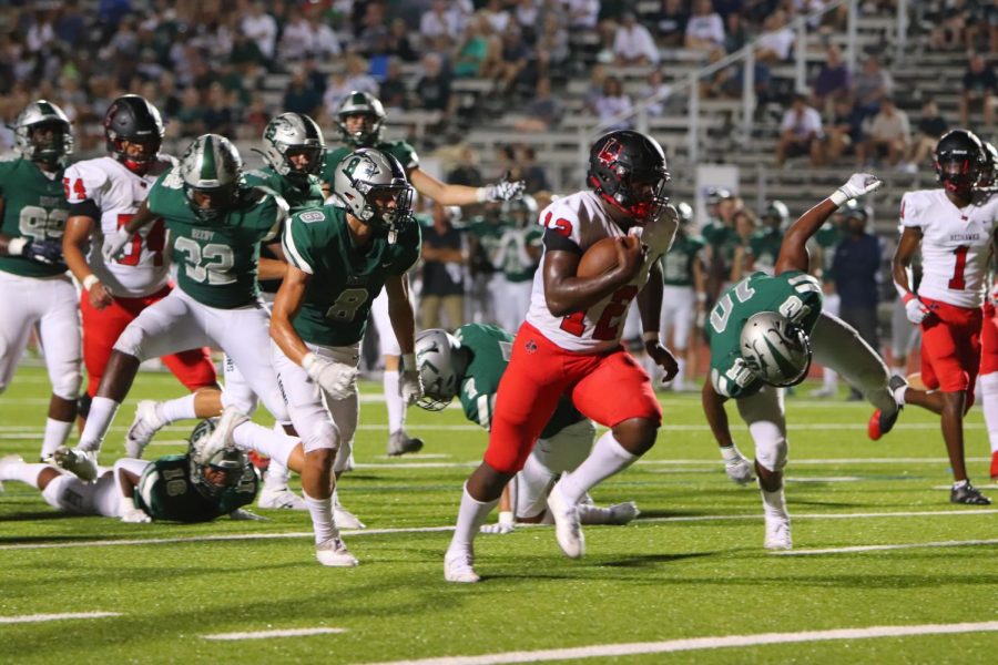 Breaking through the Reedy defense, quarterback Keldric Luster rushed for three touchdowns in the Redhawks season opening win. Leading for most of the game, the Redhawks found themselves down 49-42 before they scored a touchdown and 2-point conversion with :08 left in the game to win 50-49. 