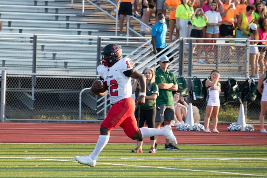 Passing for 293 yards, quarterback Keldric Luster did as much damage running as he did throwing as the junior had his hand (and feet) involved in six touchdowns in the Redhawks 50-49 win over Reedy. 