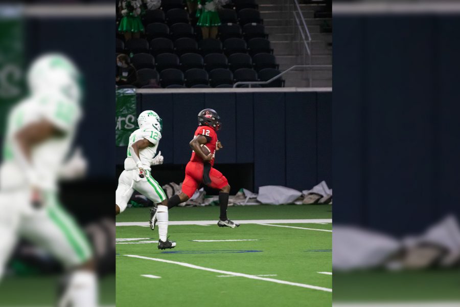 After scooping up a fumble, Redhawks quarterback (#12) Keldric Luster races into the end zone for a 62-yard touchdown run in the teams 41-24 win over Lake Dallas on Thursday at the Ford Center. Thursdays win moves the Redhawks to 5-0 overall, and 3-0 in District 7-5A. 