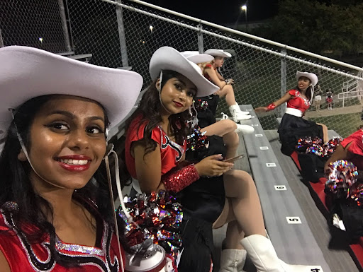 Red Rhythm dancer Aashi Oswal (pictured far left) poses for a selfie with her teammates. The team is kicking it back in season for tryouts for next school year. 