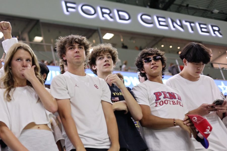 Dressed all in white for White Out night at the Ford Center, Redhawk fans watch the team as they take on Lake Dallas. The Redhawks won 41-24 to improve to 4-0 on the season. 