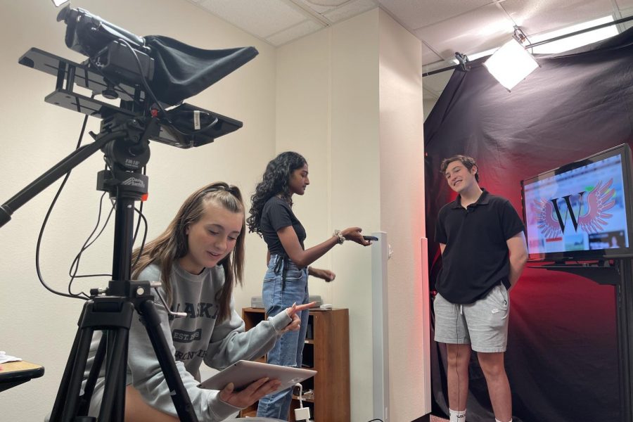 Senior executive producers Alyssa Murphy, Kirthi Gummadi, and Cooper Ragle film the WTV Daily Update. On Thursday, the show was recognized as a National Scholastic Press Association Pacemaker finalist, one of the highest honors for high school journalism.