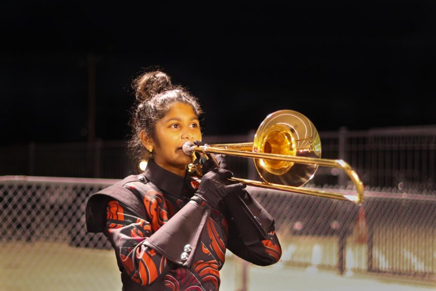 Sophomore Haasini Busireddy plays her trombone for a football game. Sophomore Jemil Logan plays his clarinet for the football game. As the marching band season has come to a close, Redhawk students have been rehearsing for All-Region auditions. As results have come out, it seems over 36 students will be a part of this years All-Region program. 