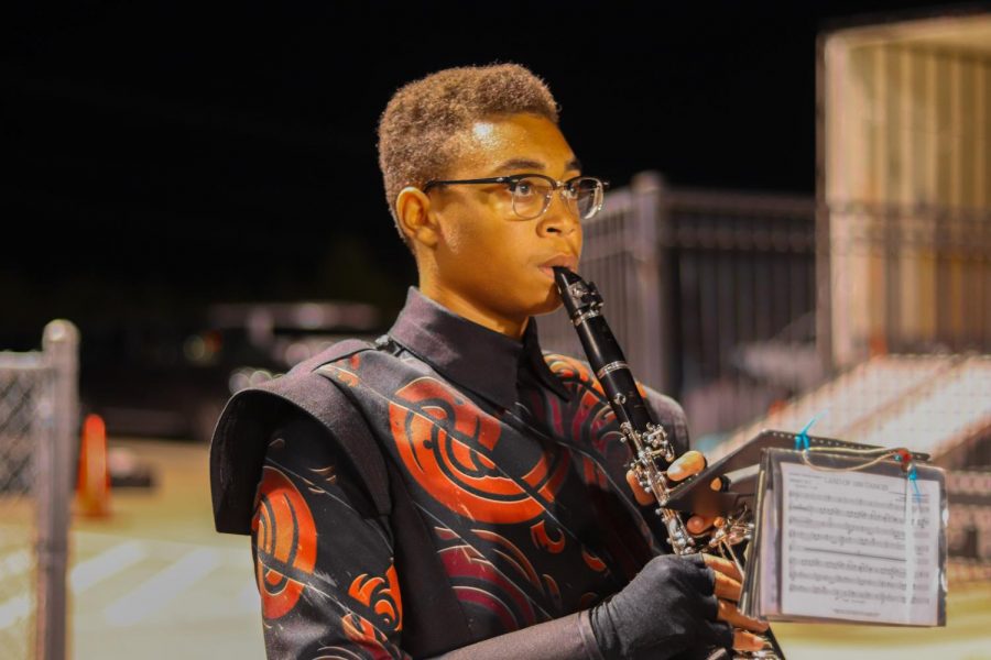 Sophomore Jemil Logan plays his clarinet for the football game. As the marching band season has come to a close, Redhawk students have been rehearsing for All-Region auditions. As results have come out, it seems over 36 students will be a part of this years All-Region program. 