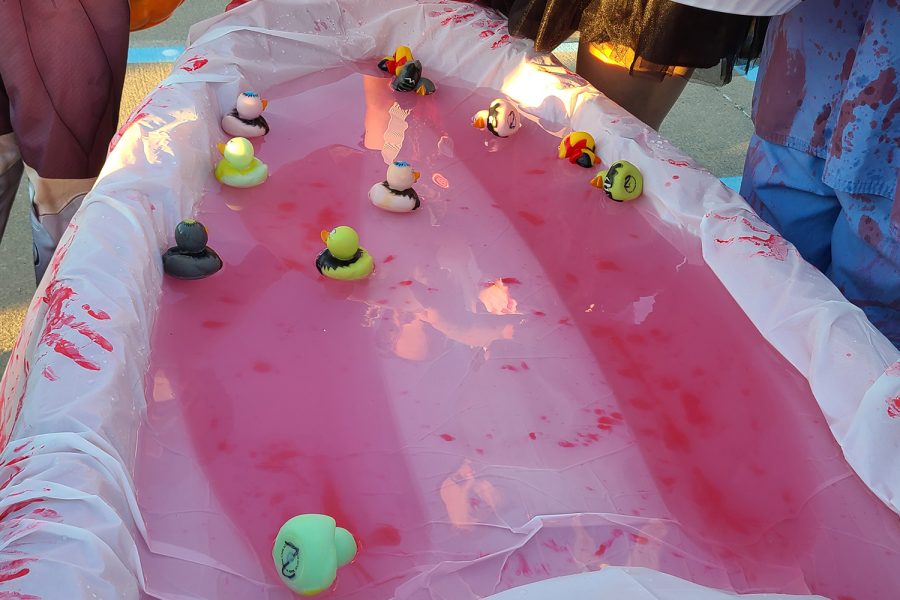 For some clubs, teams, or organizations, getting candy required more than saying trunk or treat. At the softball dstop, a number of the bottom of the floating rubber ducks determined how many pieces of candy were received. 