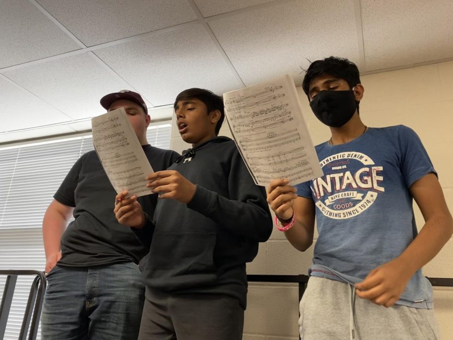 Pictured: Krishna Rajagopal (center) practicing sight-reading with two section members. Vowels, consonants, diction, and dynamics are in the back of every choir students mind as UIL contest approaches. Beginning Tuesday, all three choirs on campus will sing their hearts out in the state-wide competition. 