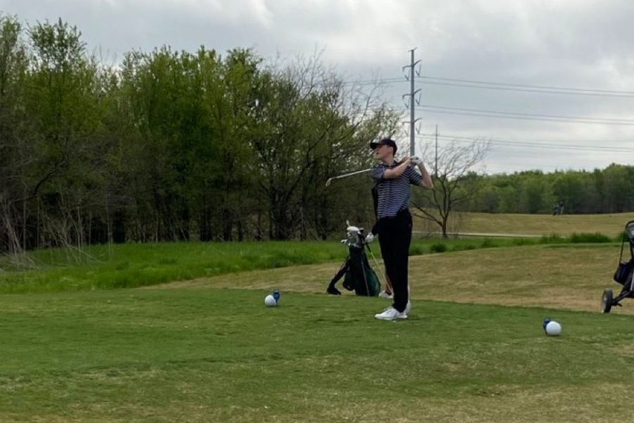Freshman Brody Batjer watches his tee shot on the 18th on day 2.