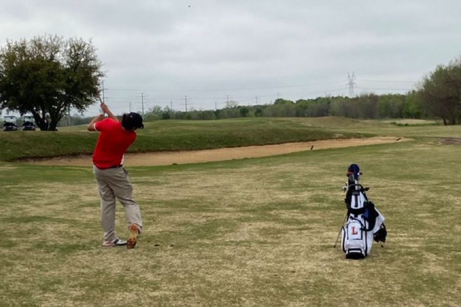 Sophomore Kaden Crocetti takes his approach shot on the 1st hole on day 2.