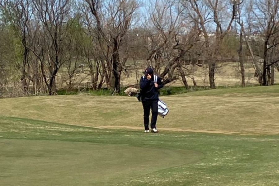 Sophomore Phillip Sun strolling up to the 1st green on the 1st day.