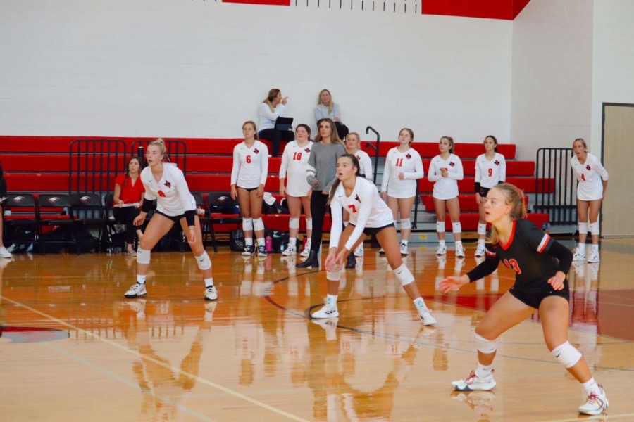 Volleyball soared over the Centennial Titans on Tuesday, winning 3-0 and moving into first place in District 10-5A. They will face the Independence Knights on Friday, who are ranked just below the Redhawks.