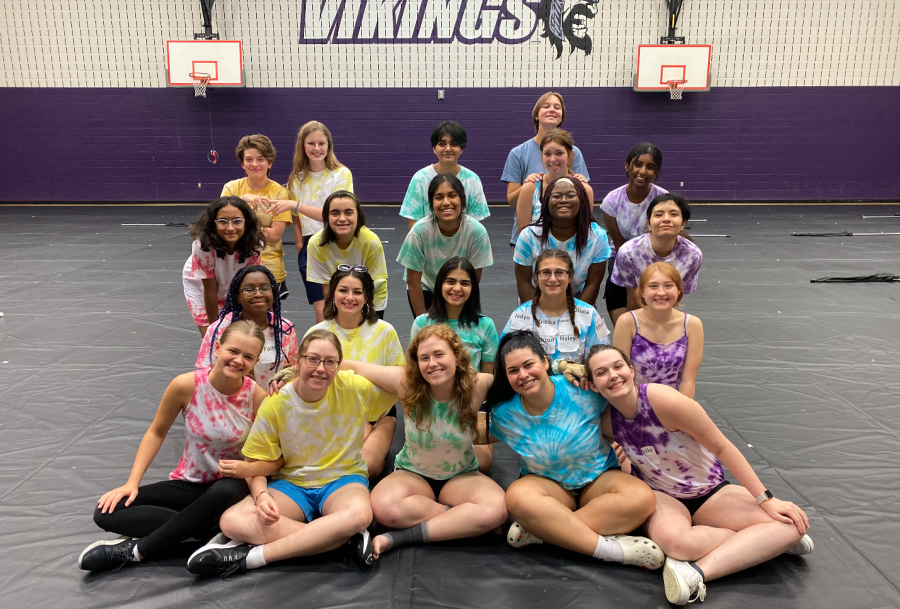 Pictured%3A+the+Redhawk+color+guard+practices+in+the+Vandeventer+Middle+School+gym.+Over+the+summer%2C+the+guard%2C+as+well+as+band+students%2C+attended+Vandeventer+for+practices+in+preparation+for+their+fall+show%2C+Queen+Bee.+Despite+having+to+adjust+to+a+new+location+due+to+school+renovations%2C+both+departments+were+able+to+get+ahead+of+schedule+in+their+rehearsals+for+this+upcoming+year.+