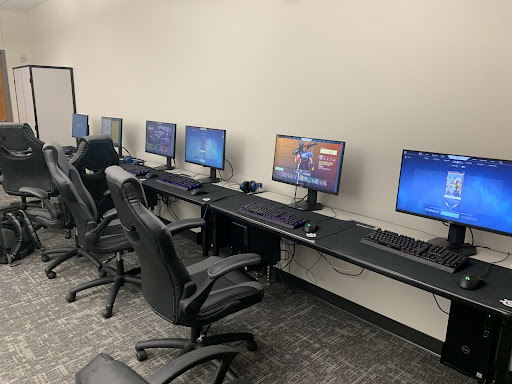 The esports class provides 6 gaming computers in room E102 that include peripherals like the Logitech G Pro Wireless and Razer BlackWidow V3. Students are able to play most games like Valorant through special permissions.
