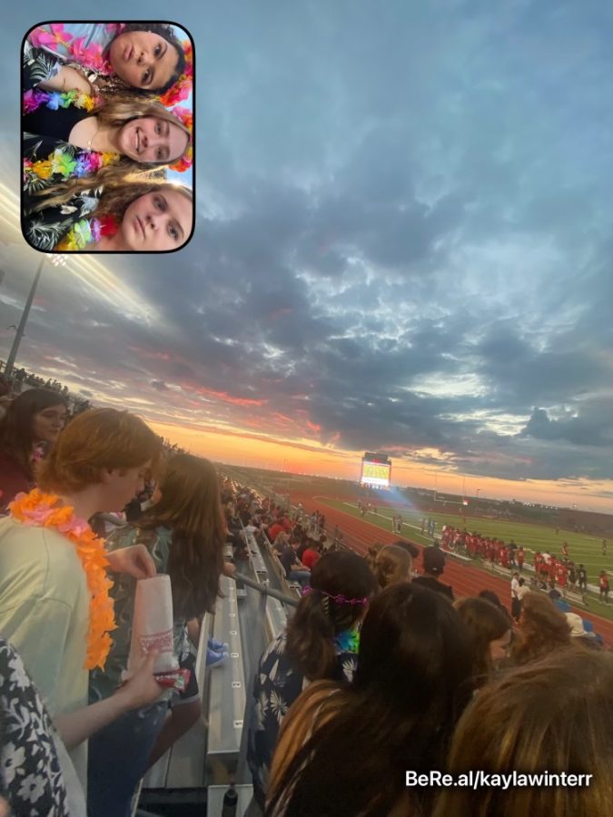 As the app allows students to document aspects of their daily lives, it often goes off during school hours or school events. Juniors Sadie Johnson, Kayla Winter, and Gabbi Fasciano (top to bottom) were able to use the BeReal at a football game.