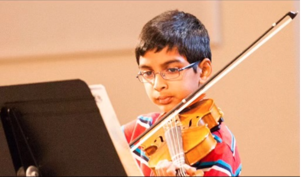 A young Ram Bonthala is pictured playing a violin. In this week’s edition of Artistic Expressions, Wingspan sits down with sophomore Bonthala as he discusses his experience as a violinist.

