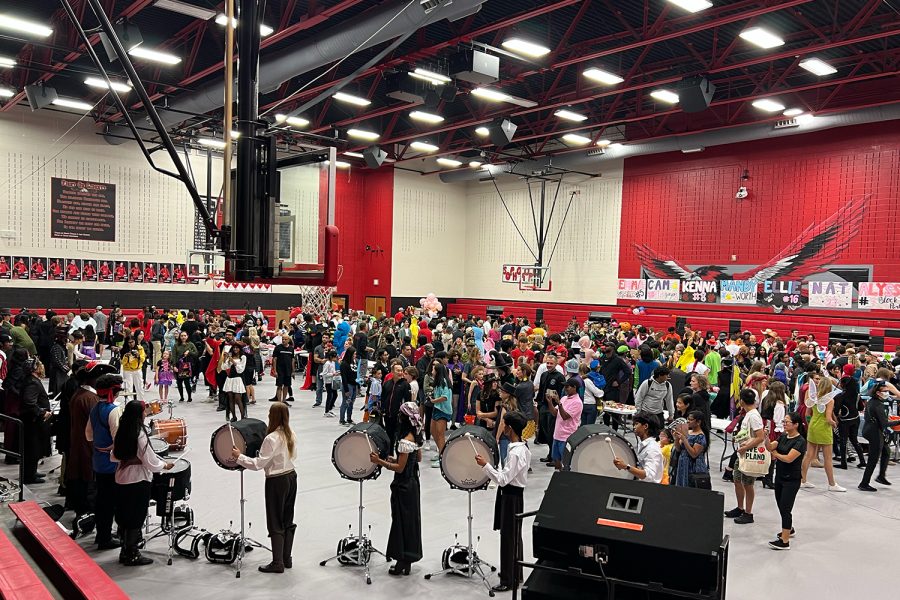 With the drumline set up in one corner of the gym, hundreds of students, staff, and community members took over the school on Monday for bands annual Trunk or Treat. 