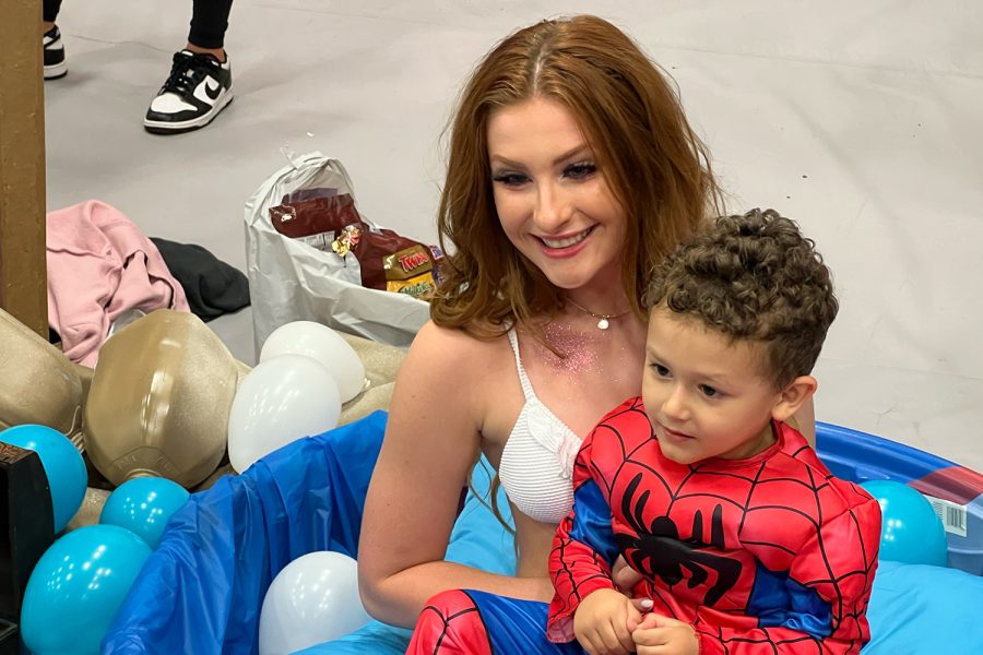 Spider-Man meets a mermaid (senior Allie Elgin) at Best Buddies Peter Pan themed table at Mondays Trunk or Treat. In addition to handing out candy, young Trunk or Treaters could also get a picture with the mermaid. 