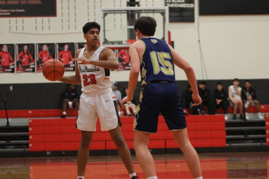 Pictured: Boys’ basketball faced the Jesuit Rangers earlier this season. Flash forwarding to the opening game in the district 10-5A, the Redhawks were able to secure a victory against the Emerson Mavericks, winning 75-47. 