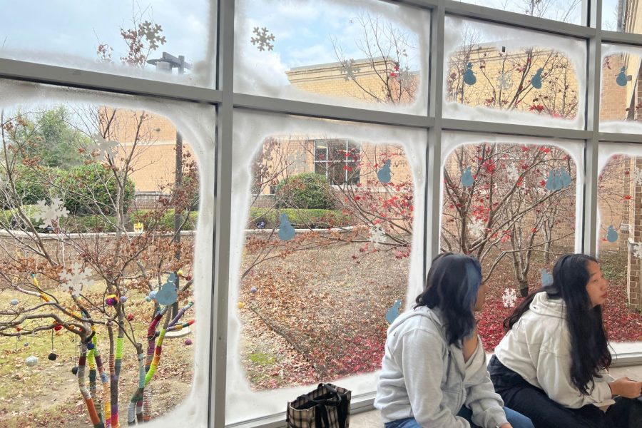The windows of the rotunda are decorated with fake snow and snowflakes in light of the holiday season. StuCo has been working on decorating the school to create a cozy, wintry atmosphere.
