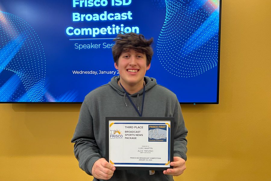 Senior Alex Trevino poses with his award for 3rd place in the district Broadcast Sports News Package. 