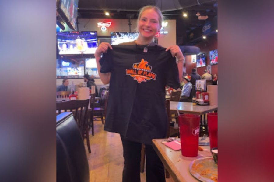 Taking on a fiery challenge, senior Anna Lyon and junior Blake Lyon participated in Pluckers contest to become a member of the Wall of Flame. Anna was able to successfully eat 15 fiery wings, while Blake came close, eating 13.