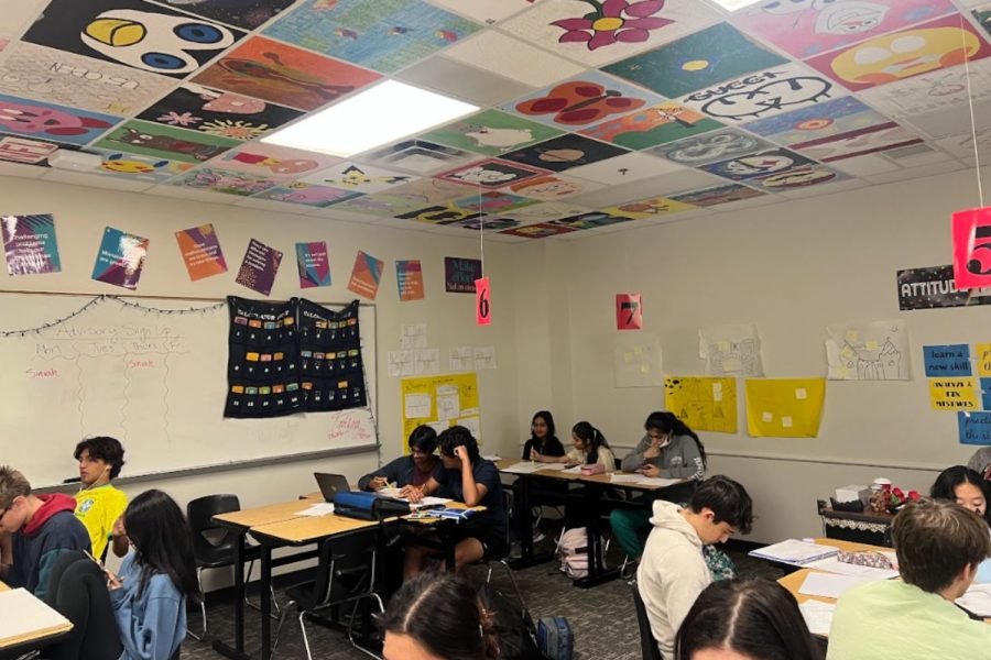 Pre-calculus students are painting ceiling tiles to better understand the final unit of the year, conics. Once the tiles are painted, they will displayed throughout the schools ceiling.