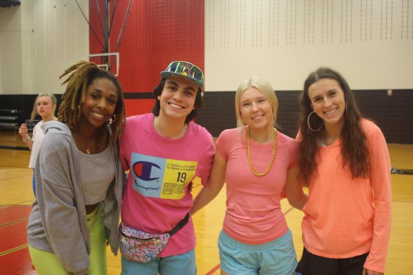 Juniors Tierany Scott, Joaquin Perez, Avery Peters, and Kathryn Murphy are decked out in 80s based outfits.