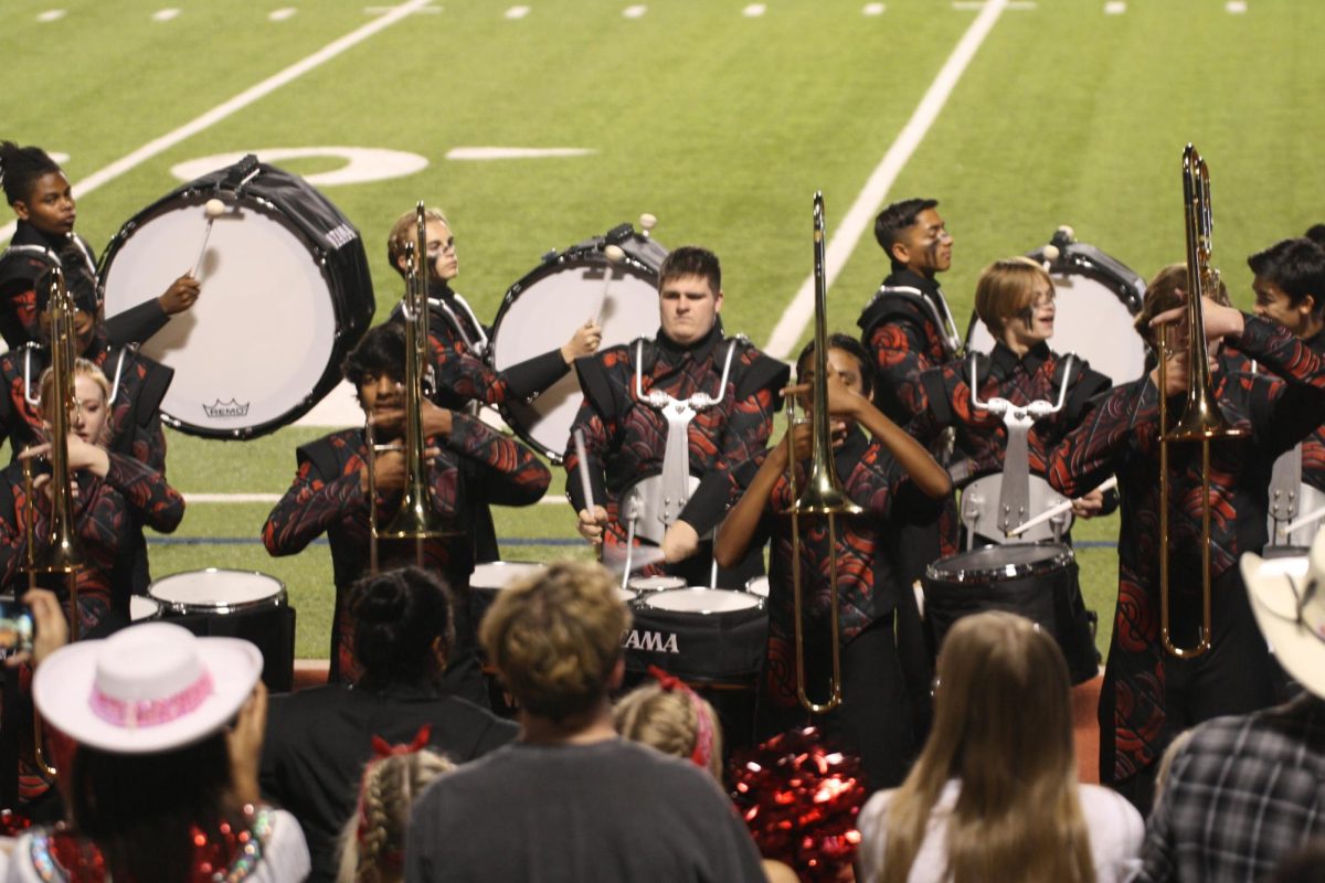Band is seen preforming their infamous head choppers for Redhawk fans.