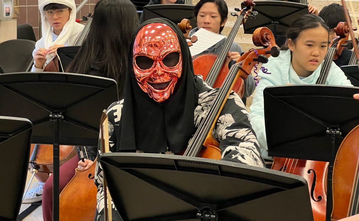 Students such as sophomore Alp Sahin dressed up during the performance to showcase their Halloween spirit.