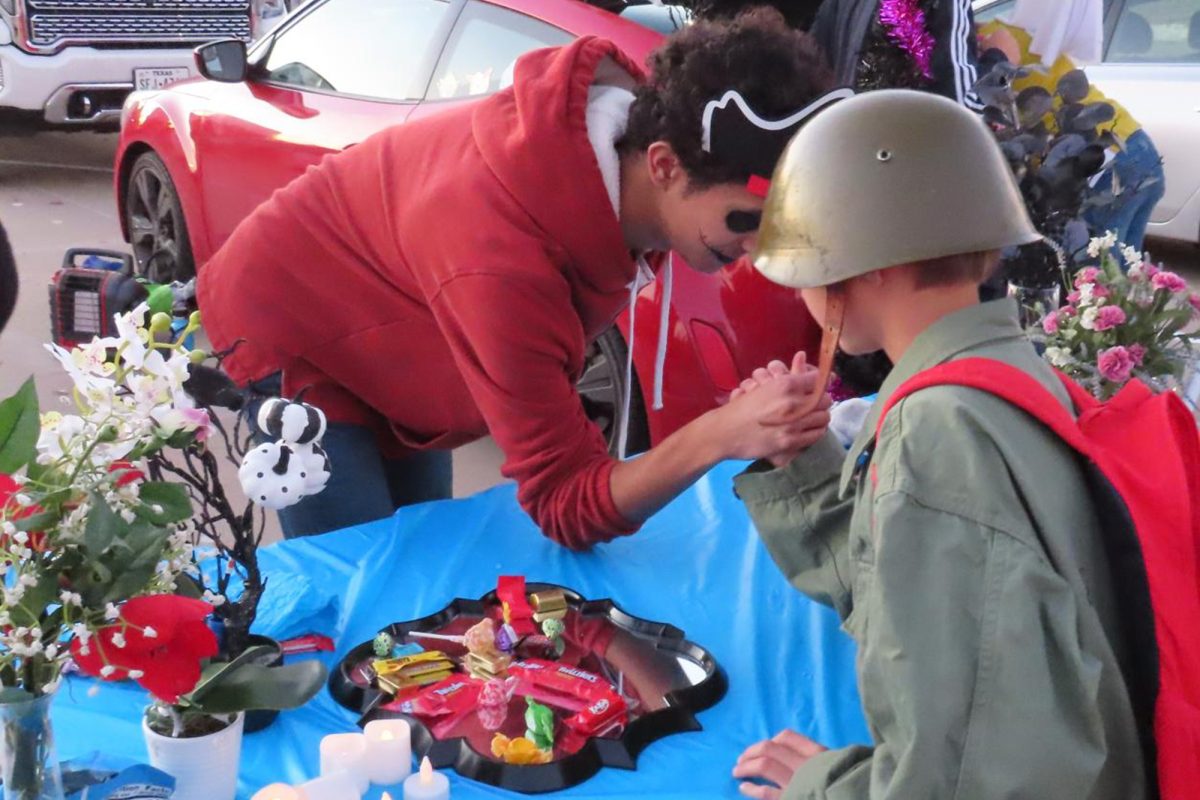 Students provided engaging activities for the Trunk R Treaters such as arm wrestling, as pictured by the ghoul and GI Joe. 