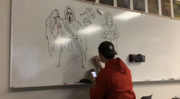 English II teacher Grayson Moore showcases his artistic prowess on a whiteboard on the social media platform, TikTok.