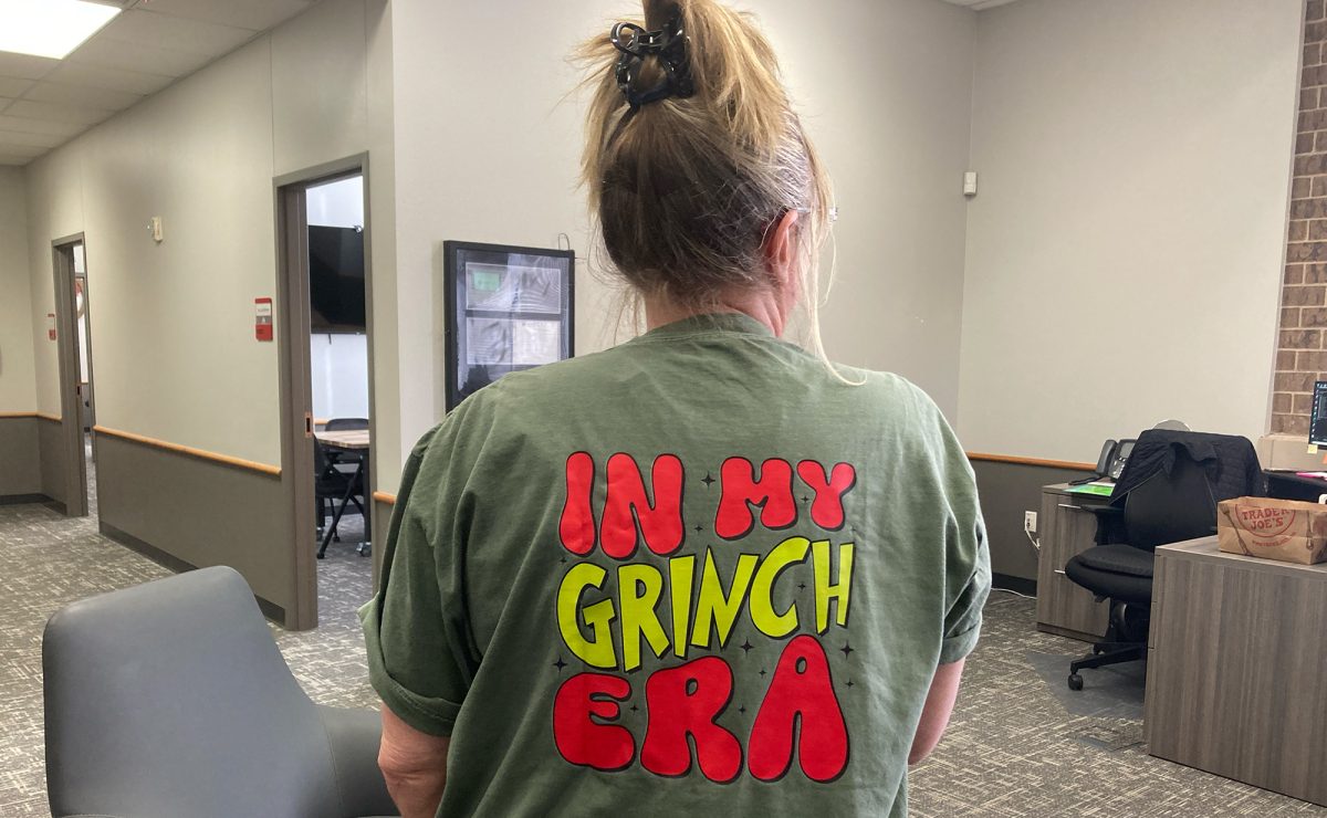 Dec. 11-21 are holiday dress up themes on campus with the theme for Tuesday, Dec. 12 all things Grinch, including the back of culinary arts teacher Lisa Frizzell. 