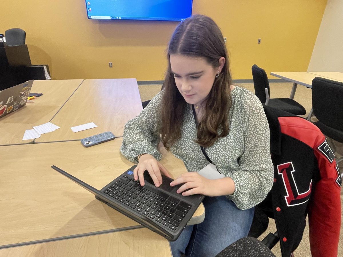 Many students on campus, including junior Lauren Pratt (pictured), use their Chromebooks on the daily. To keep them in working in order, students should update their Chromebooks regularly.