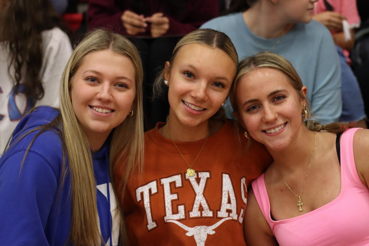 Romantic love was not the only type of love that was celebrated at the Romance Rally. Juniors Bea Dunlop, Olivia Forden, and Addyson Schick smile as they celebrate friendship. 