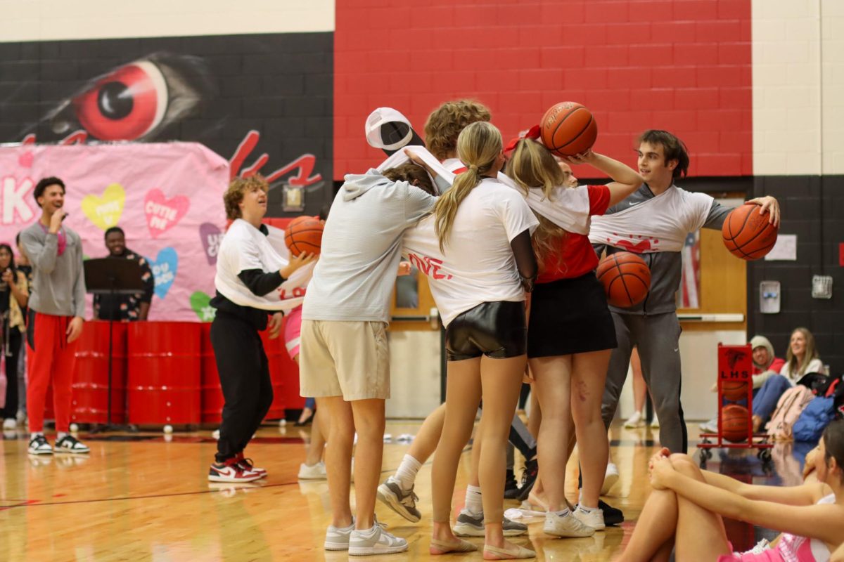 Competing for the ultimate prize, the romantic couples on campus completed a series of games to win a teddy bear. This event was at a Romance Rally held by Student Council during advisory. 