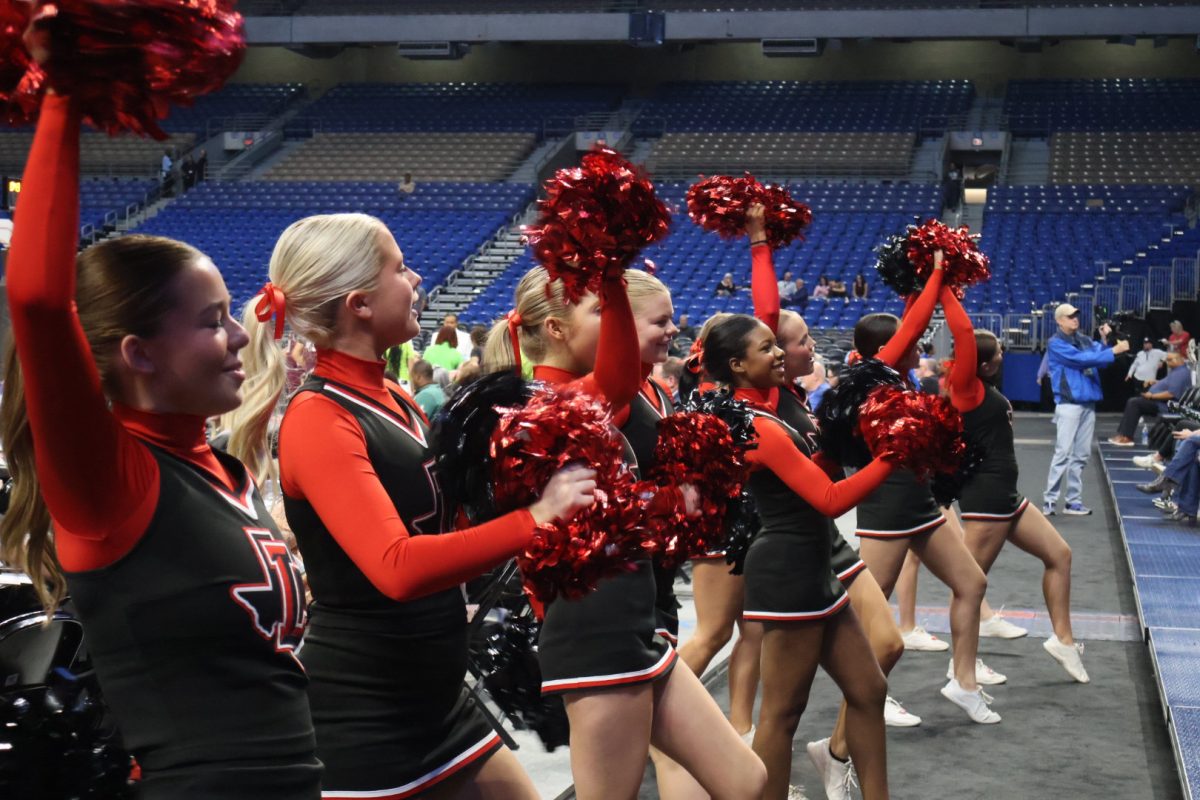 Among the Redhawks making their way to San Antonio for the UIL 5A state tournament was the varsity cheer team who spent Saturday cheering for the girls basketball team as the Redhawks beat Mansfield Timberview 60-51.