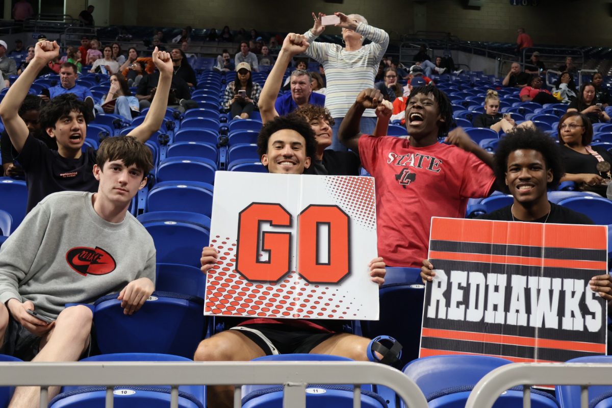 Supporting the girls basketball team, several members of the Redhawks boys basketball team made the five journey from campus to San Antonio.