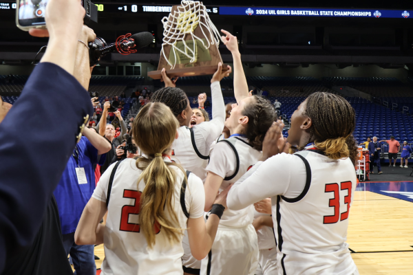 With the UIL 5A state championship trophy in hand, the Redhawks celebrated their second straight title at midcourt of the Alamodome on Saturday. 