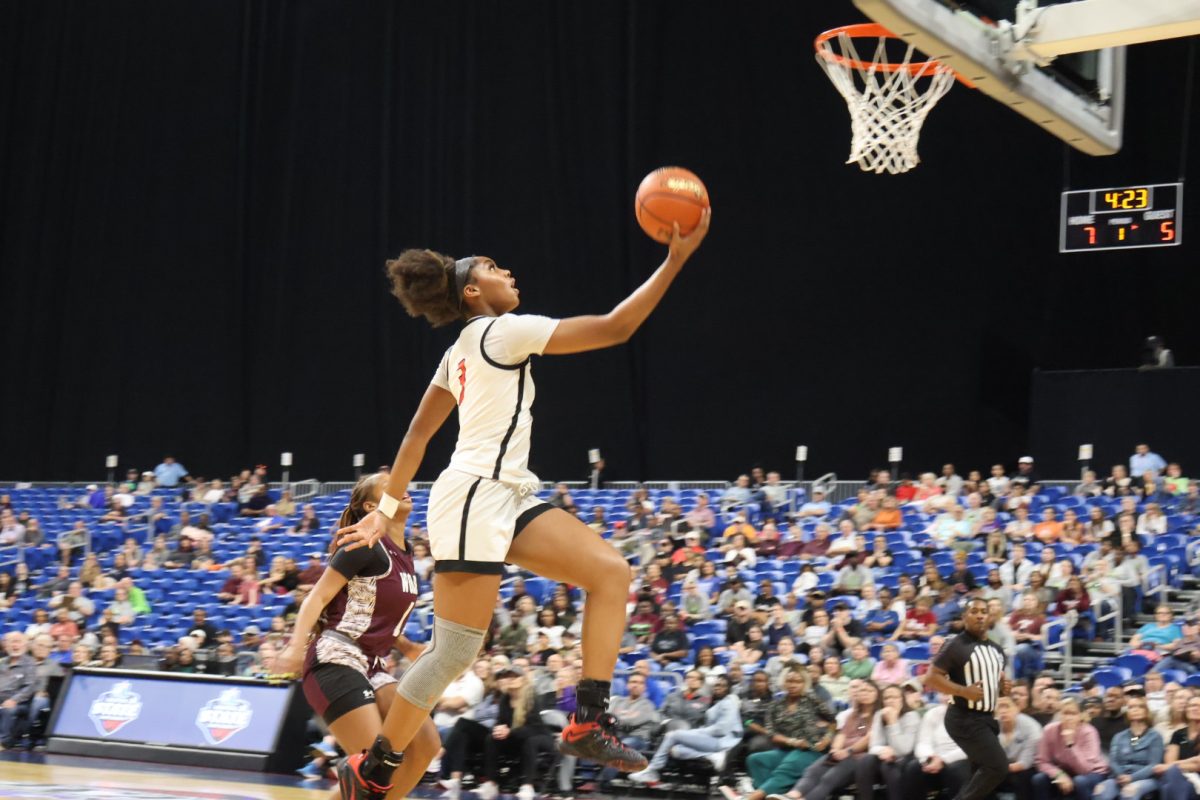 Facing+multiple+defensive+looks+from+Timberview%2C+including+being+double-teamed%2C+sophomore+Jacy+Abii+found+herself+with+a+clear+path+to+the+basket+during+Saturdays+UIL+5A+state+championship+game+in+San+Antonios+Alamodome.+