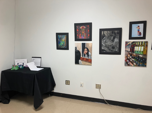 The National Art Honor Society are posting new art works in the art gallery, allowing students to view their peers work,