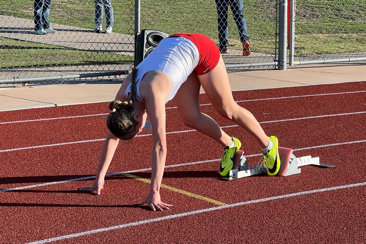 Setting up at the starting blocks for the 4x400 at the Area meet, senior Delaney Davidson and the rest of the relay team advanced to the regional meet Friday and Saturday at UT-Arlington. 