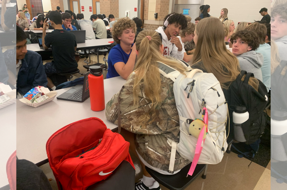 Junior Jaiden Harris is also joining in on the school spirit wearing a camo t-shirt as she hangs out with friends during advisory.