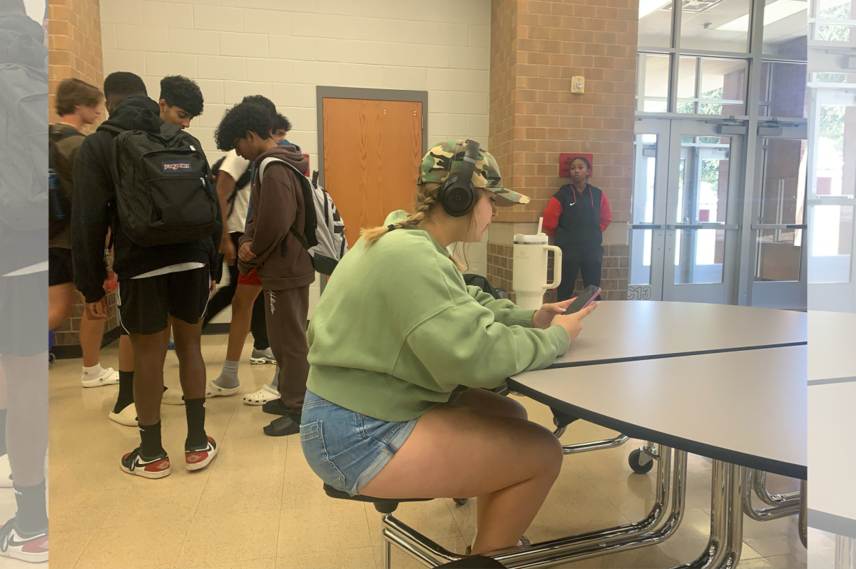 Senior Tatum Wooley decided to dress up by donning a camo baseball cap and an olive green sweatshirt.