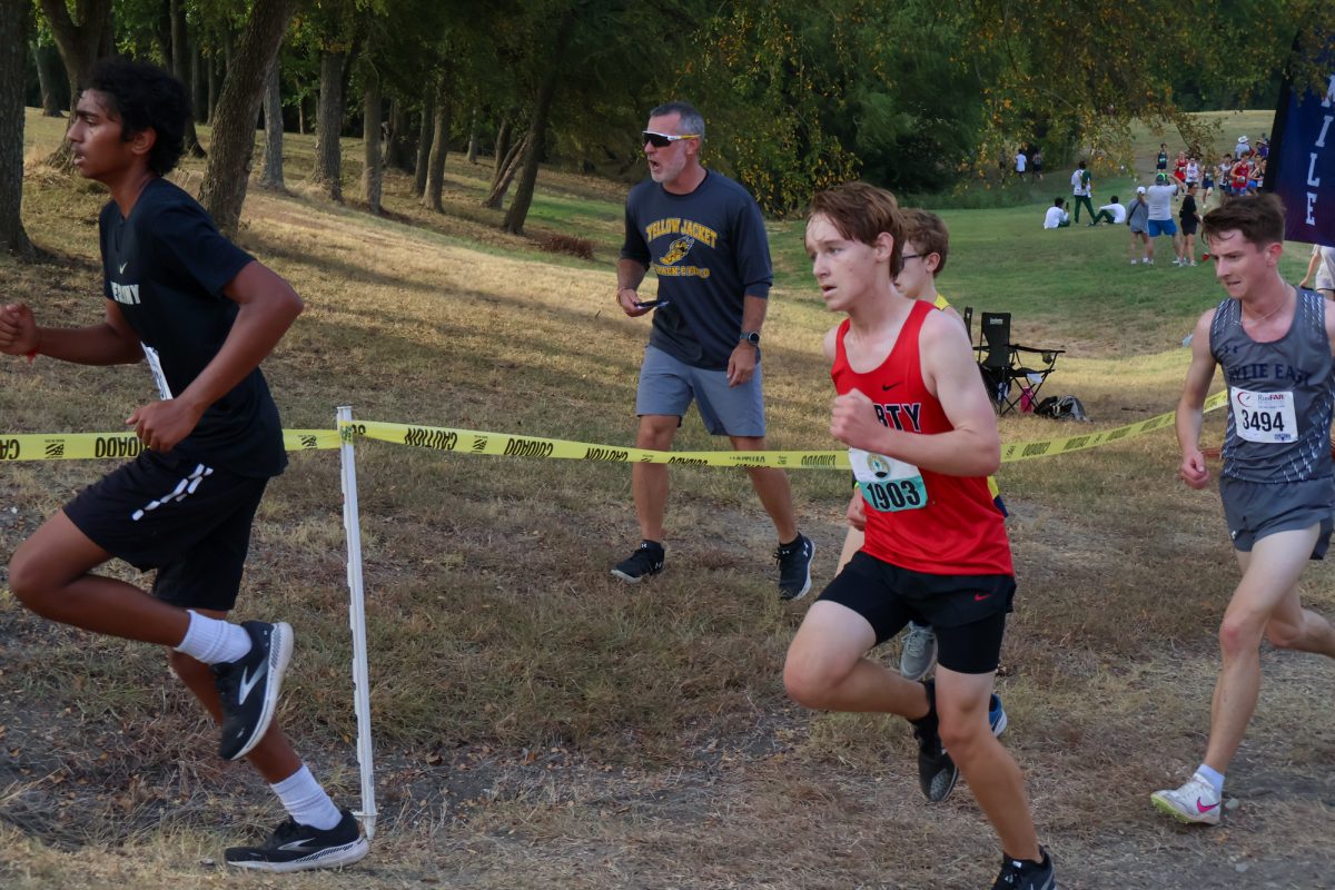 Freshman Eric Pratt uses the hill to pass fellow competitors.